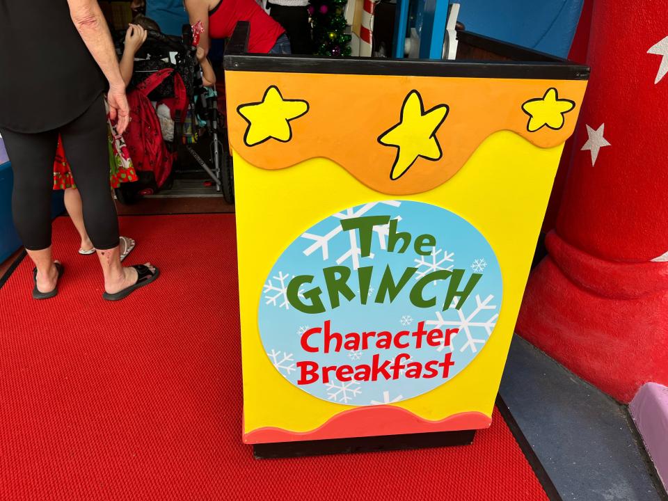 the grinch character breakfast podium
