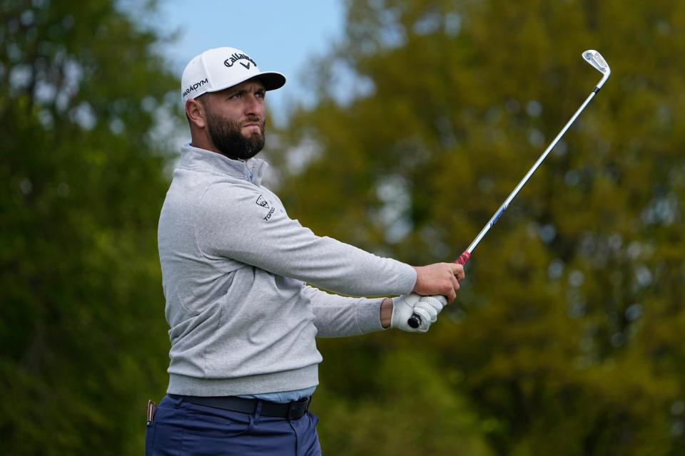 Jon Rahm tees off on the 12th hole during Wednesday's practice round at Oak Hill Country Club.