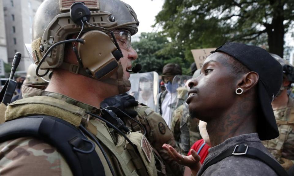 A National Guard solider and a demonstrator in Washington last week.