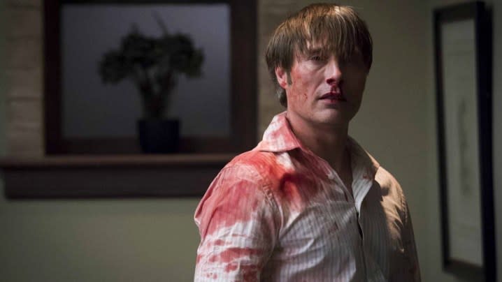 Mads Mikkelsen as Hannibal in bloody shirt