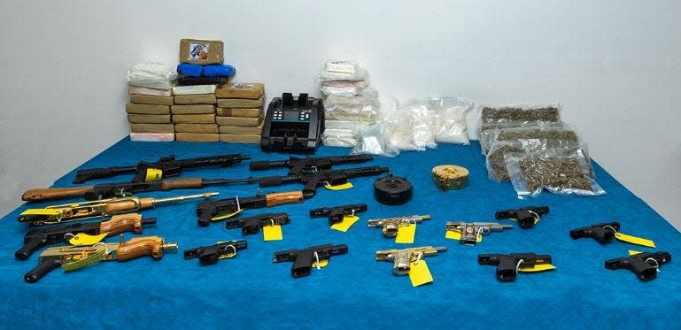 Athens-Clarke police display the guns and drugs seized following the arrests of three men in Athens.