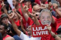 Supporters of former Brazilian President Luiz Inacio Lula da Silva wait for his arrival after he was released from prison, in Sao Bernardo do Campo