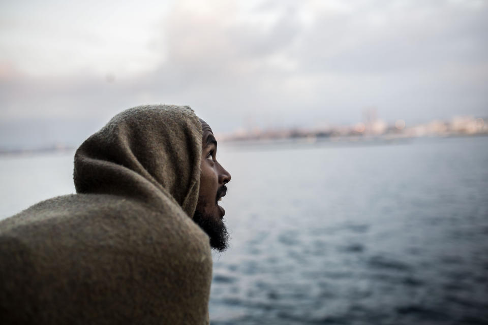 FILE - In this Dec. 28, 2018 file photo, a migrant looks out as he approaches the port of Crinavis, in Algeciras, Spain, after being rescued in the Central Mediterranean Sea. Frontex chief Fabrice Leggeri said Wednesday, Feb. 20, 2019 that there is "no burning crisis" right now in Europe due to migrant arrivals, but that more and more African people are trying to enter Spain from Morocco. (AP Photo/Olmo Calvo, File)