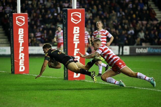 Penrith Panthers’ Nathan Cleary (left) scores