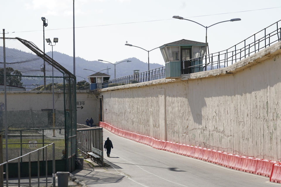 FILE - An inmate walks around the exercise yard at San Quentin State Prison on April 12, 2022, in San Quentin, Calif. California could reinstate voting rights to felons while they are in prison in a major expansion of suffrage for incarcerated people if a bill currently before the state legislature passes despite an uphill battle. (AP Photo/Eric Risberg,File)