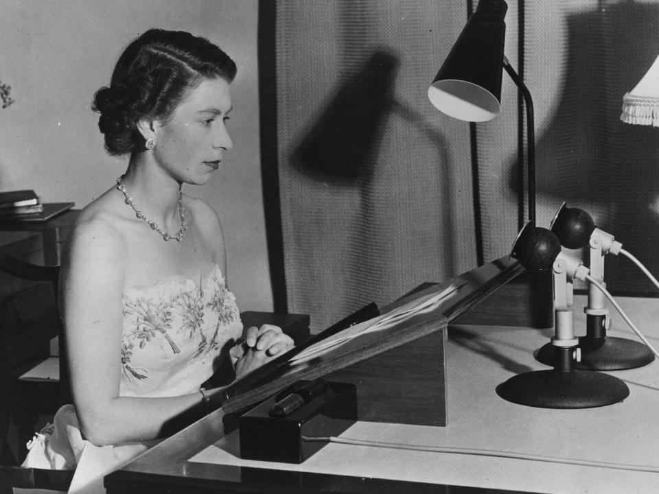 Queen Elizabeth II makes a radio broadcast from Auckland, New Zealand during a Royal tour of Australasia in 1953.