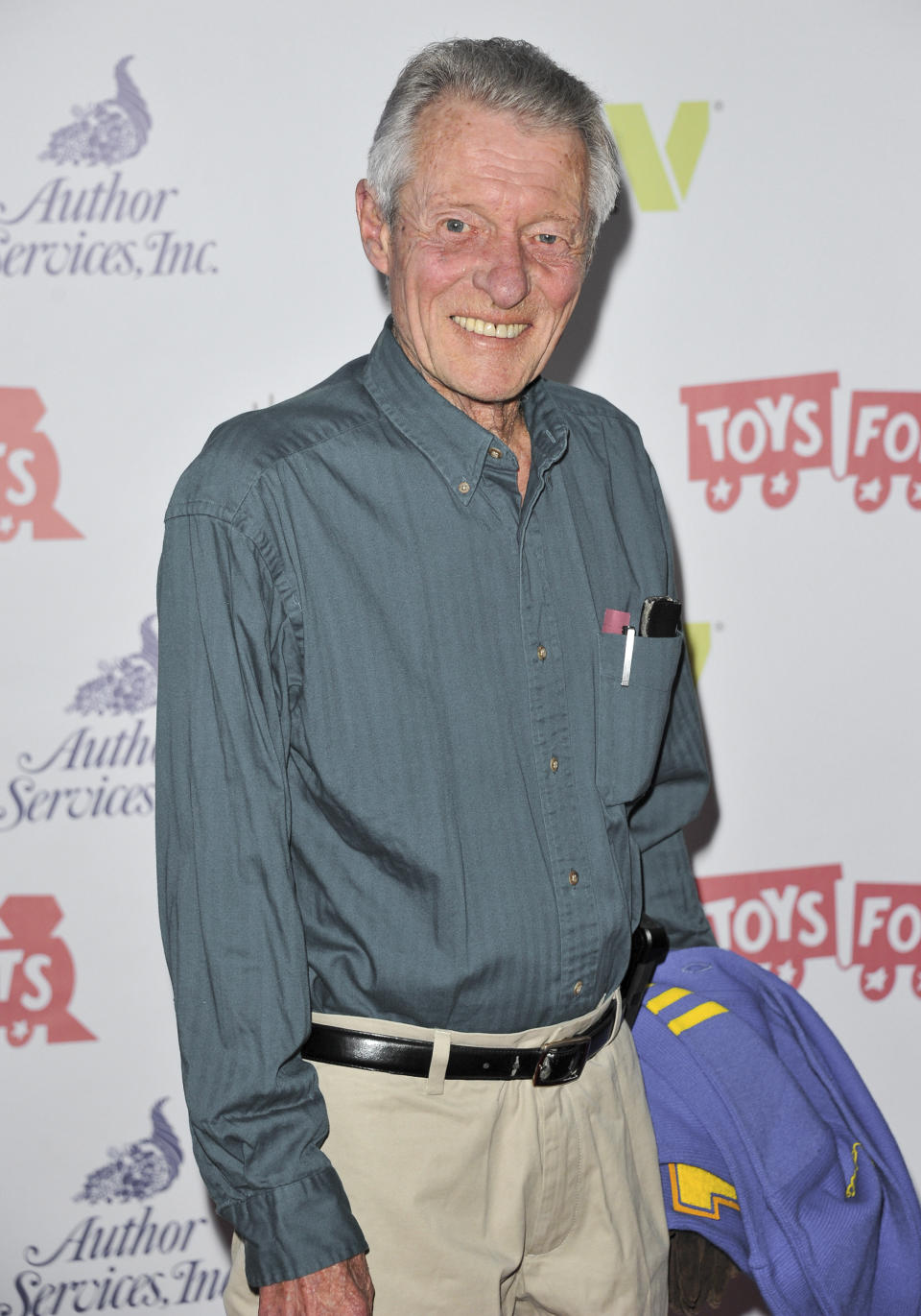 FILE - This Dec. 1, 2013 file photo shows Ken Osmond at the 82nd Annual Hollywood Christmas Parade in Los Angeles. Osmond, who played the two-faced teenage scoundrel Eddie Haskell on TV’s “Leave it to Beaver,” has died. Osmond's family says he died Monday, May 18, 2020, in Los Angeles. He was 76. (Photo by Richard Shotwell/Invision/AP, File)