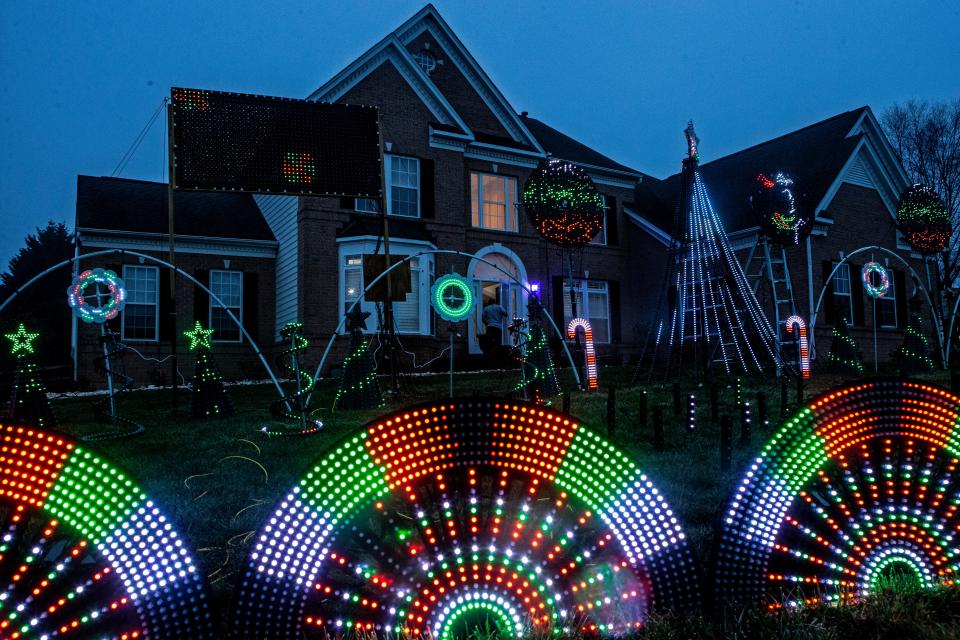 A segment of the 31,000 Christmas lights display by Manny Duarte stands outside his home in Middletown, Wednesday, Dec. 7, 2022. The lights on display are synchronized to Christmas carols, a project that takes months to put together.