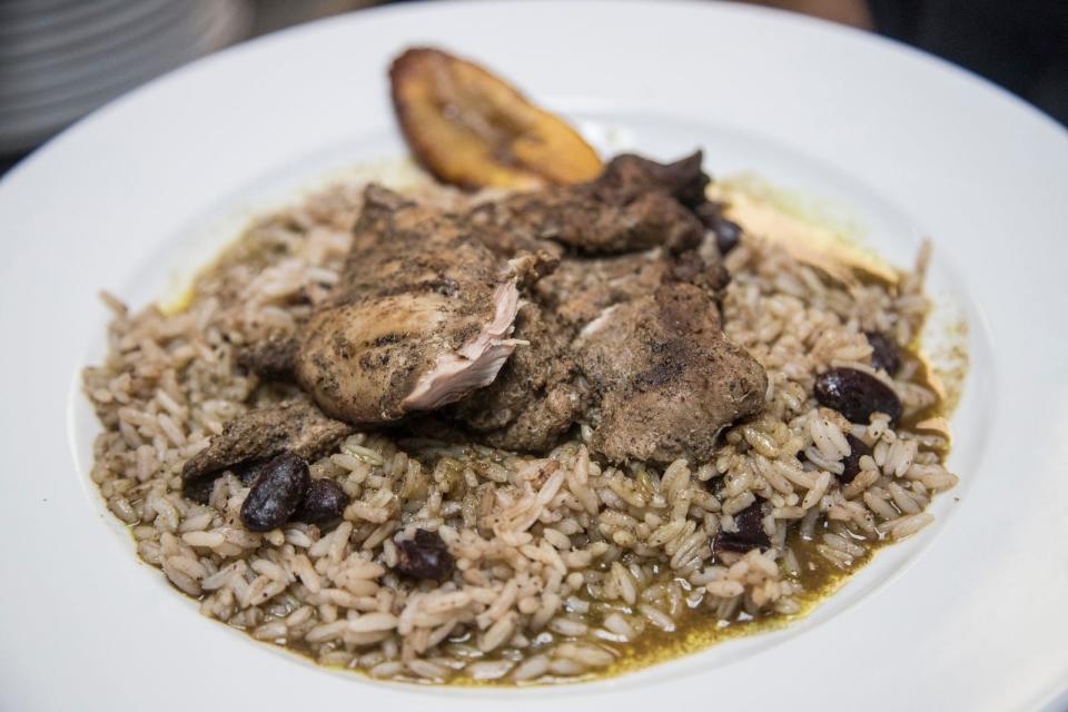 Jerk chicken on red beans and rice at Norma G's in Detroit, Tuesday, July 30, 2019.