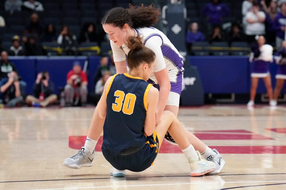 Pickerington Central's Berry Wallace wrestles with Olmsted Falls' Emily Scina (30) for control of the ball during a Division I state semifinal last year.