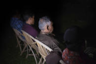 Palm oil workers gather in Sumatra, Indonesia, on Friday, Sept. 7, 2018, to discuss labor abuses that plague the industry. Many interviews with The Associated Press took place secretly in homes or shops in towns or villages near plantations, sometimes late at night, to protect workers from potential retaliation. (AP Photo/Binsar Bakkara)