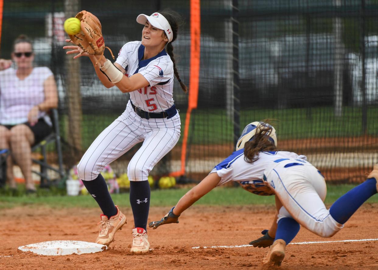 Isabella LaGreca of Park Vista makes it to third base before Ella Christopher of Lake Brantley can apply the tag during the FHSAA state Class 7A softball semifinals in Clermont, FL Friday, May 27, 2022. Craig Bailey/FLORIDA TODAY via USA TODAY NETWORK