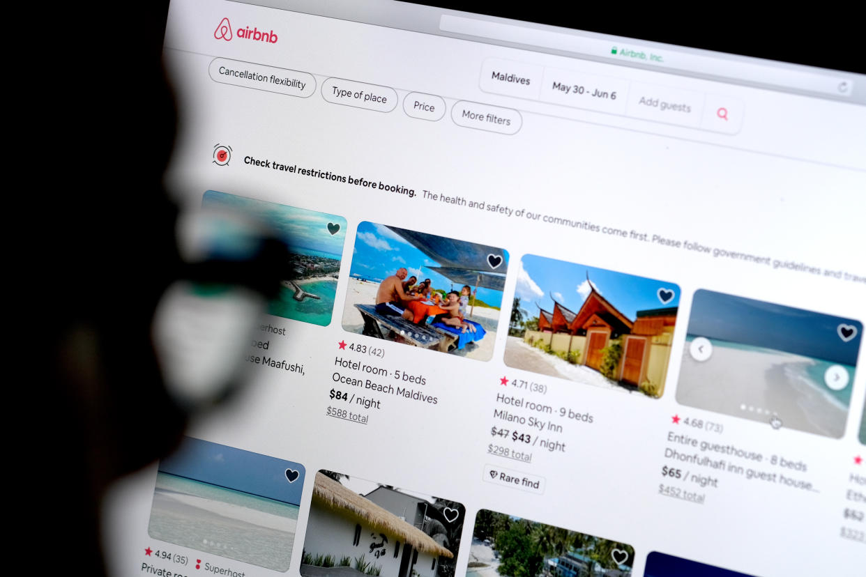 KATWIJK, NETHERLANDS - APRIL 20: In this photo illustration, a man looks at the website of Airbnb on April 20, 2020 in Katwijk, Netherlands.  (Photo by Yuriko Nakao/Getty Images)