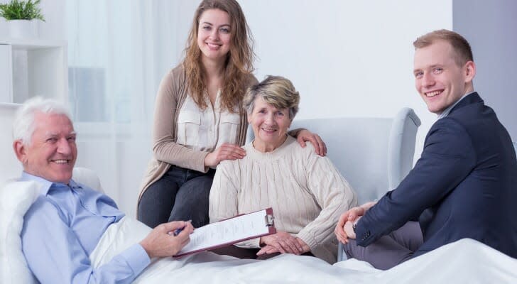 A hospitalized man signs his last will and testament