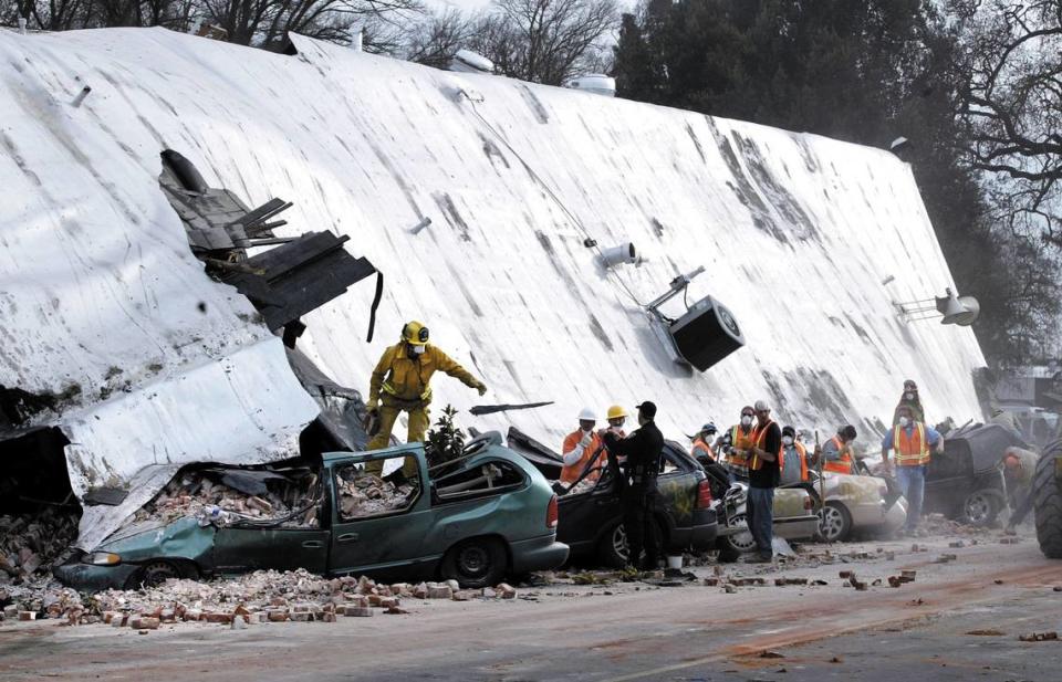 PASO ROBLES, CALIFORNIA Fire and rescue workers clear debris from the collapsed Pan Jewelers Building in downtown Paso Robles Monday afternoon Dec. 22, 2003 after a 6.5 earthquake destroyed several buildings there and crushed a number of cars.