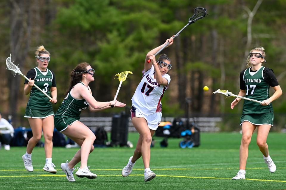 Lincoln-Sudbury senior Ava Vadgama loses control of the ball as she attempts to make her way past Westwood senior Vivian Bean, Westwood junior Kate Sullivan and Westwood senior Hillary Noble during a girls lacrosse game at Lincoln-Sudbury High School, Friday, April 19, 2024.