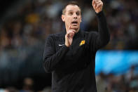 Phoenix Suns coach Frank Vogel directs the team against the Denver Nuggets during the first half of an NBA basketball game Wednesday, March 27, 2024, in Denver. (AP Photo/David Zalubowski)