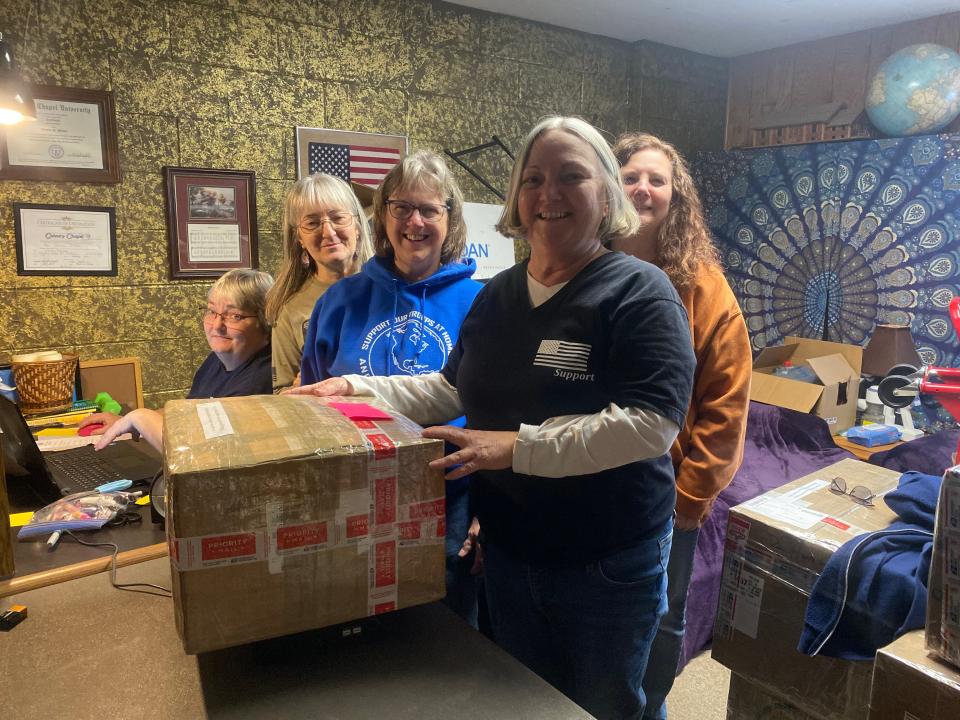 The Yellow Ribbon Girls (left to right) Patti Phillipi, Bonnie Phillippi, Carolyn Gallagher, Vickie Henley and Tammi Smith as they prepare to send off their last package.