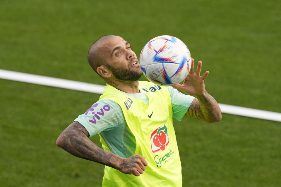Brazil's Dani Alves controls the ball during a training session at the Continassa sporting center, in Turin, Italy, on Nov. 15, 2022. Reactions around the country spanned from anger to disappointment when Brazil coach Tite uttered the name of veteran Dani Alves in his call for the World Cup squad. The Brazil coach described his pick in a not-so-confident tone. Tite said “the criteria for Daniel Alves is the criteria for all.” Alves himself recognized that many didn’t want him in the squad for Qatar. (AP Photo/Antonio Calanni, File)