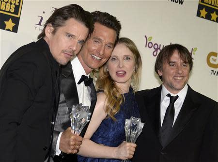 Writer/actor Ethan Hawke (L), writer/actress Julia Delphy and writer/director Richard Linklater (R) pose backstage with their Louis XIII Genius Award along with actor Matthew McConaughey, who holds his award for best supporting actor for the film "Dallas Buyers Club" at the 19th annual Critics' Choice Movie Awards in Santa Monica, California January 16, 2014. REUTERS/Kevork Djansezian