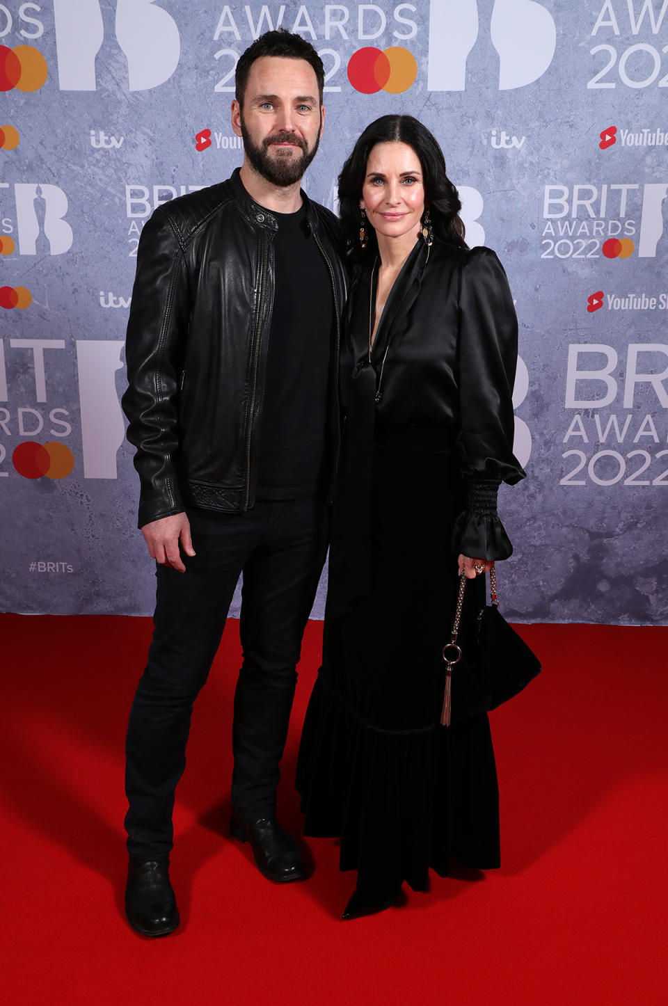 Johnny McDaid and Courteney Cox arrive at the 2022 Brit Awards