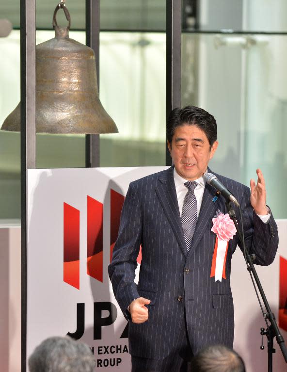 Japan's Prime Minister Shinzo Abe delivers a speech during a ceremony to celebrate the last trading day of 2013 at the Tokyo Stock Exchange, on December 30, 2013