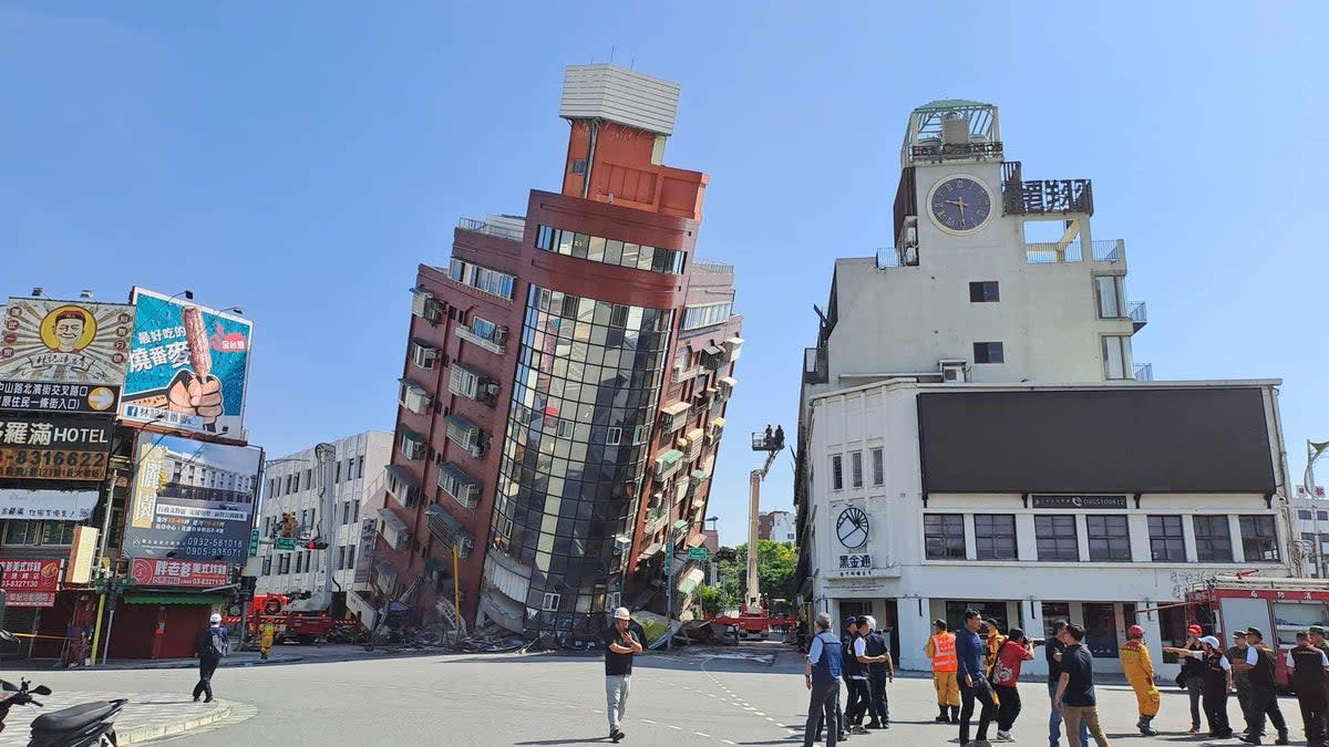 A red building is partially collapsed after a powerful 7.3-magnitude earthquake rocked Taiwan (VCG via Getty Images)