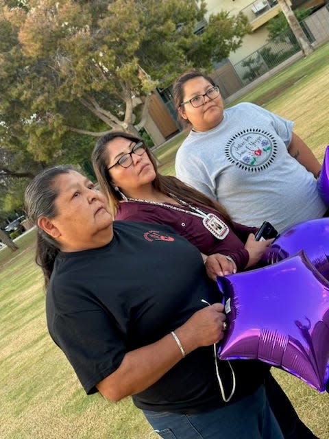 Jamie Yazzie’s mother, Ethelene Denny, her aunt Marilene James and sister Elaina Denny celebrate Jamie’s birthday on Sept. 13, 2023, by releasing purple balloons. The family members have been in Phoenix attending the trial of Tre C. James, who is accused of killing Yazzie.
