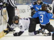 Toronto's Jocelyne Laroque (3) and Minnesota's Brooke Bryant (17) tumble during the first period of a PWHL hockey game in Toronto on Wednesday, May 1, 2024. (Frank Gunn/The Canadian Press via AP)