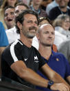 Patrick Mouratoglou smiles after watching Greece's Stefanos Tsitsipas defeat Switzerland's Roger Federer in their fourth round match at the Australian Open tennis championships in Melbourne, Australia, Sunday, Jan. 20, 2019. (AP Photo/Mark Schiefelbein)