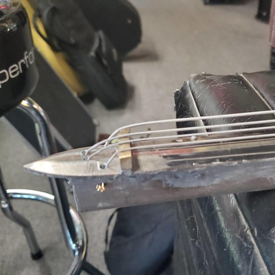 A guitar being built out of a sword