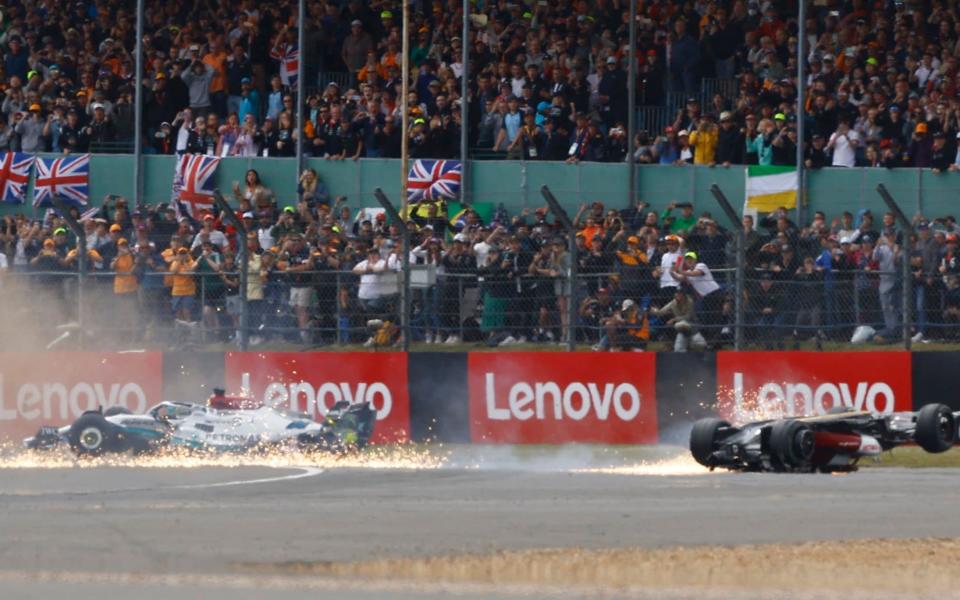 Silverstone Circuit, Silverstone, Britain - July 3, 2022 Mercedes' George Russell and Alfa Romeo's Guanyu Zhou crash out at the start of the race - REUTERS