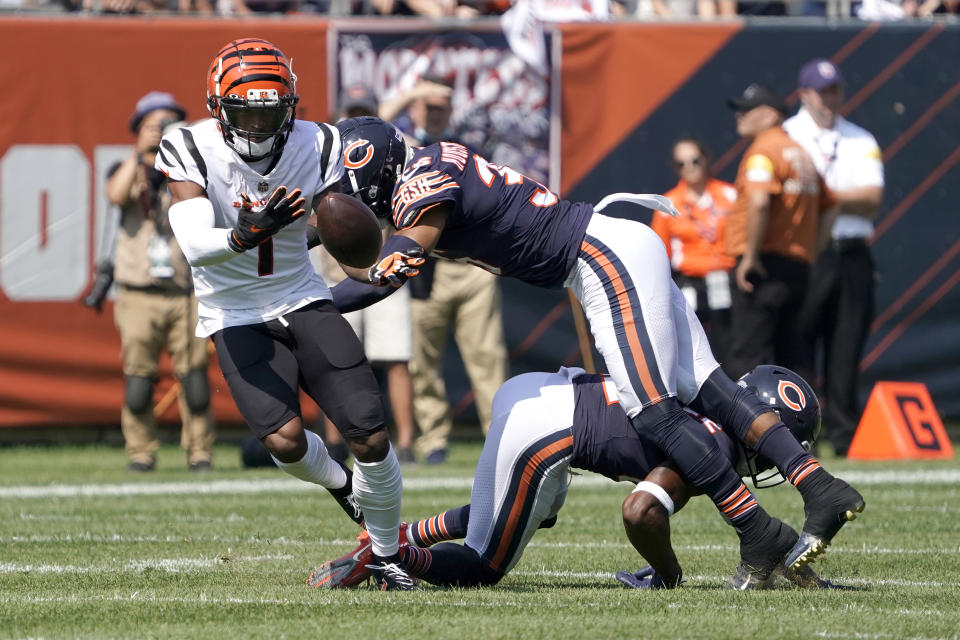 Cincinnati Bengals wide receiver Ja'Marr Chase, left, is unable to catch quarterback Joe Burrow's pass as Chicago Bears defensive back DeAndre Houston-Carson (36) and Kindle Vildor (22) defend during the first half of an NFL football game Sunday, Sept. 19, 2021, in Chicago. (AP Photo/David Banks)