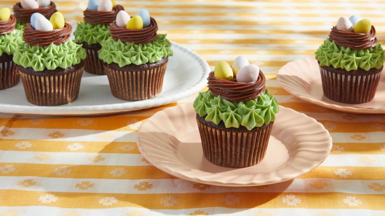 cupcakes with frosting nests and chocolate mini eggs