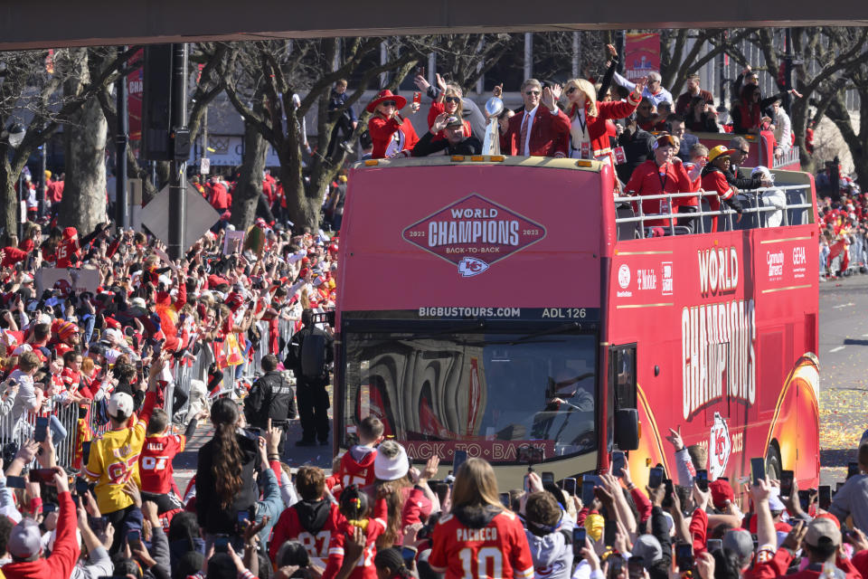 FILE - Kansas City Chiefs chairman and CEO Clark Hunt holds the Vince Lombardi Trophy as their bus arrives at the victory rally in Kansas City, Mo., Wednesday, Feb. 14, 2024. The Chiefs defeated the San Francisco 49ers Sunday in the NFL Super Bowl 58 football game. (AP Photo/Reed Hoffmann, File)