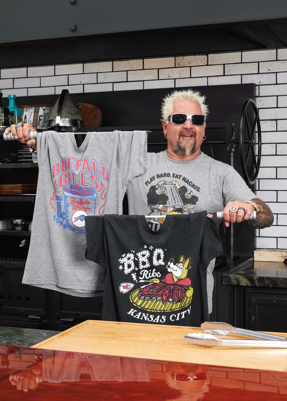 Guy Fieri is out with a new line of NFL x Flavortown T-shirts that feature a signature food for each of the 32 NFL teams.