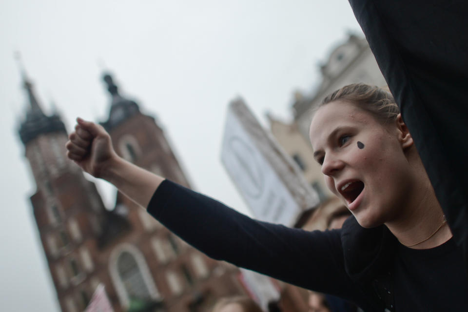 A woman in black chants in Krakow.&nbsp;