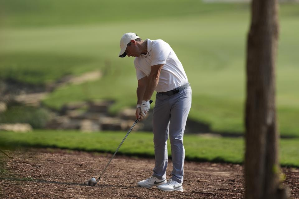 Rory McIlroy of Northern Ireland plays his second shot on the 18th hole hole during the final round of the DP World Tour Championship golf tournament, in Dubai, United Arab Emirates, Sunday, Nov. 19, 2023. (AP Photo/Kamran Jebreili)