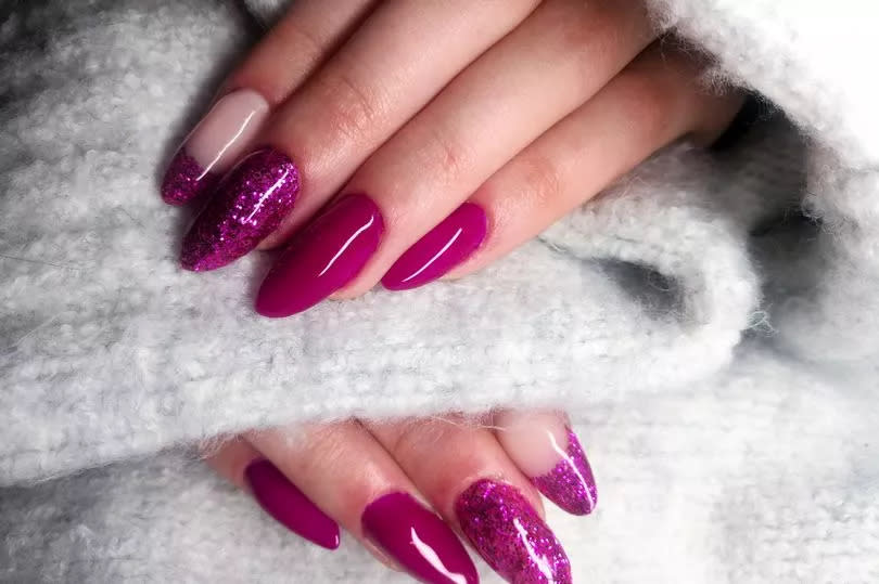 Close up of Fake Nails, Acrylic Nails, Gel nails on a woman's hand.