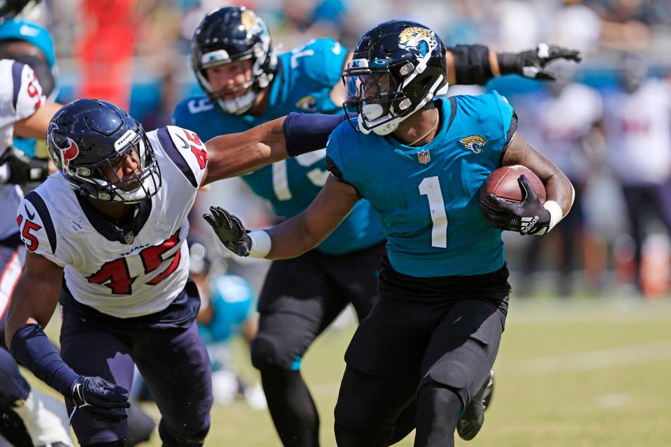 Travis Etienne of the Jaguars looks for running room during last year's 13-6 loss to the Houston Texans at EverBank Stadium.