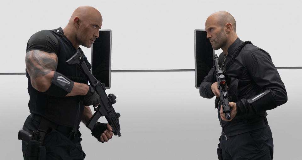 This image released by Universal Pictures shows Dwayne Johnson, left, and Jason Statham in a scene from "Fast & Furious Presents: Hobbs & Shaw." (Daniel Smith/Universal Pictures via AP)