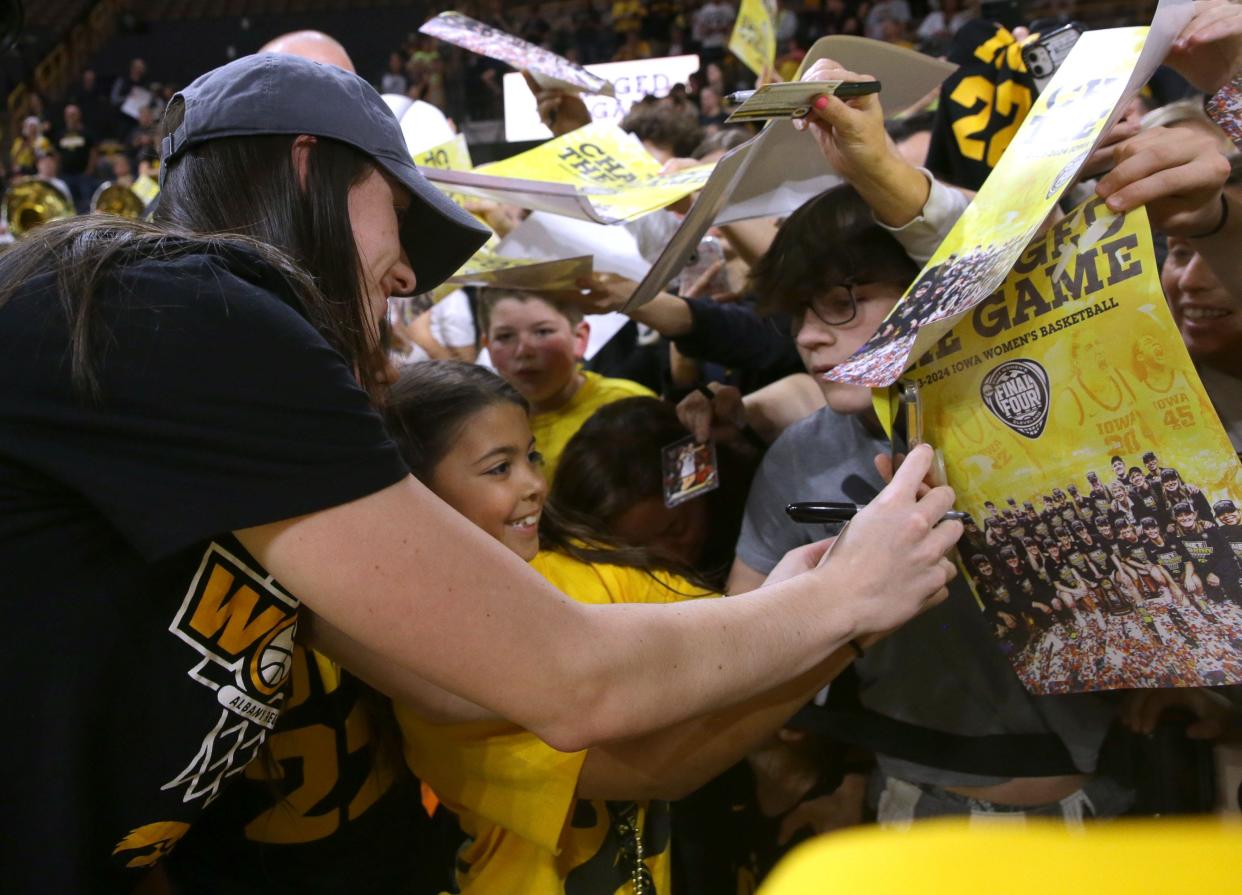 Caitlin Clark, shown here at a farewell ceremony at Iowa, is one of the biggest stars in sports right now. She'll bring her spotlight and her considerable fan base to the WNBA.