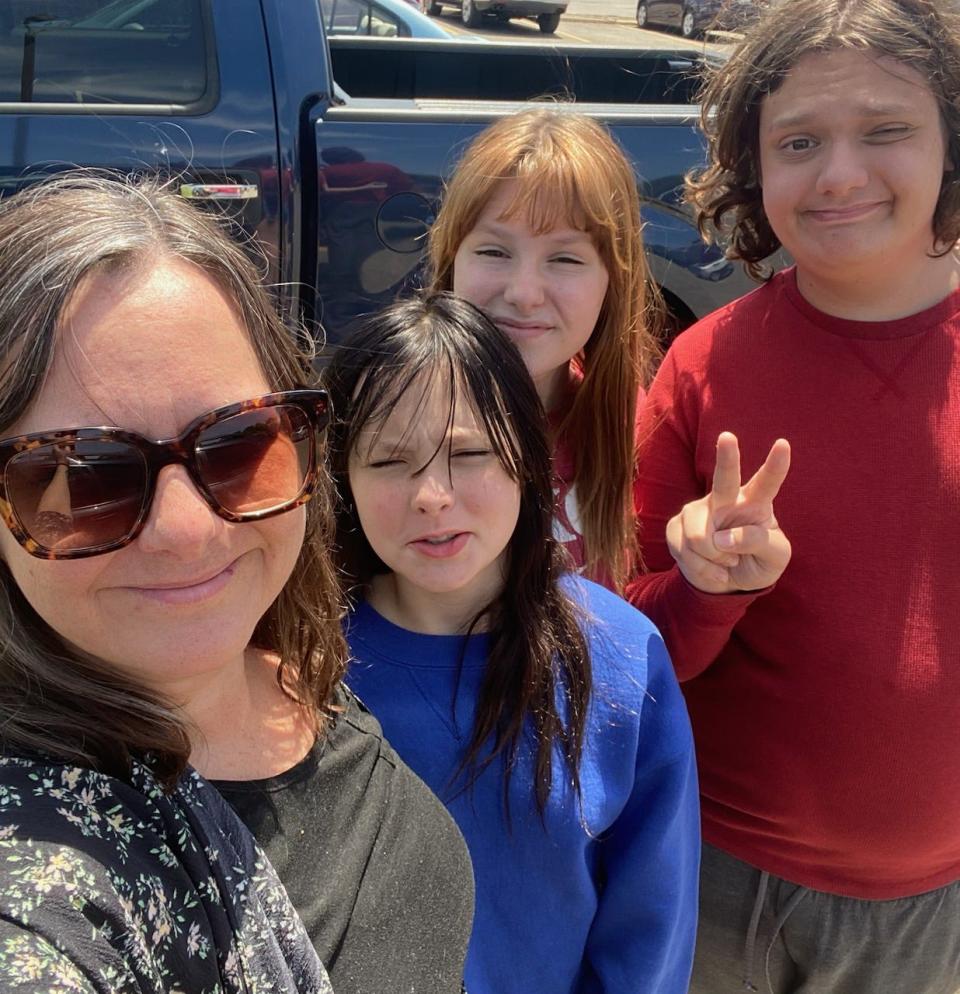 Amy Shay, left, of West Peoria, stands with her children Nico, 16, far right, Gus, 14, second from right, and Willa, 12. The children were in their house on Laura Avenue when it was hit by multiple bullets in May. They're now staying elsewhere while their mother looks for a new place to live.
