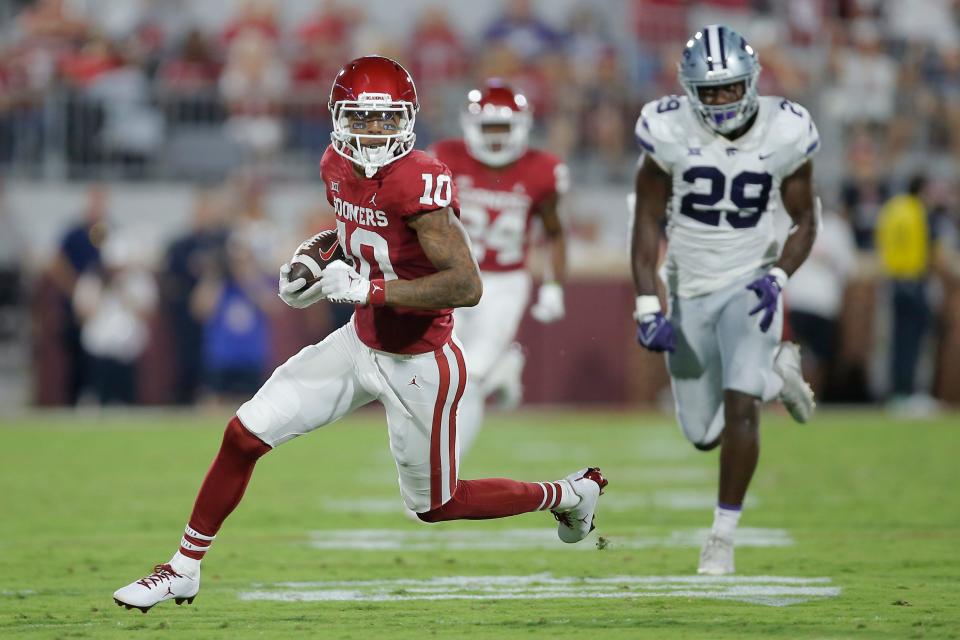 Oklahoma's Theo Wease (10) runs to the end zone past Kansas State's Khalid Duke (29) after a reception during a college football game between the University of Oklahoma Sooners (OU) and the Kansas State Wildcats at Gaylord Family - Oklahoma Memorial Stadium in Norman, Okla., Saturday, Sept. 24, 2022. 