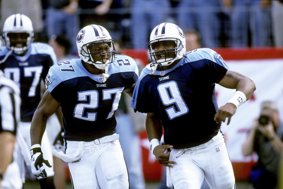 The Tennessee Titans announced on Wednesday that Nos. 27 and 9, worn by Eddie George, left, and Steve McNair, will be retired. (Getty Images)