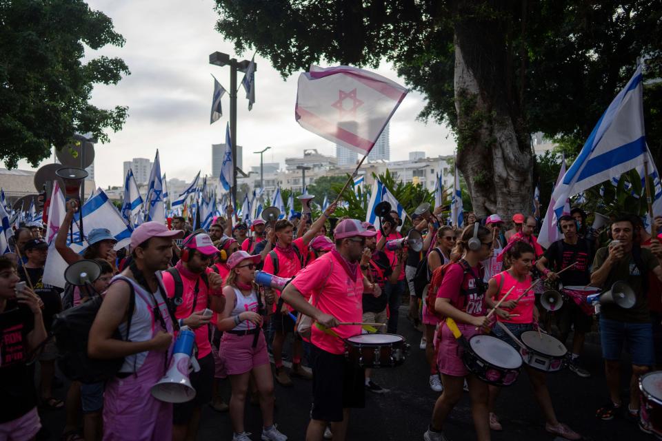 Israelis protest against plans by Prime Minister Benjamin Netanyahu's government to overhaul the judicial system in Tel Aviv, Israel, Tuesday, July 18, 2023.