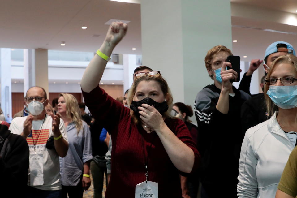 Poll challengers chant "stop the count" outside the door of the ballot counting room after being asked to leave due to room capacity at the TCF Center after Election Day in Detroit, Michigan, U.S., November 4, 2020. REUTERS/Rebecca Cook