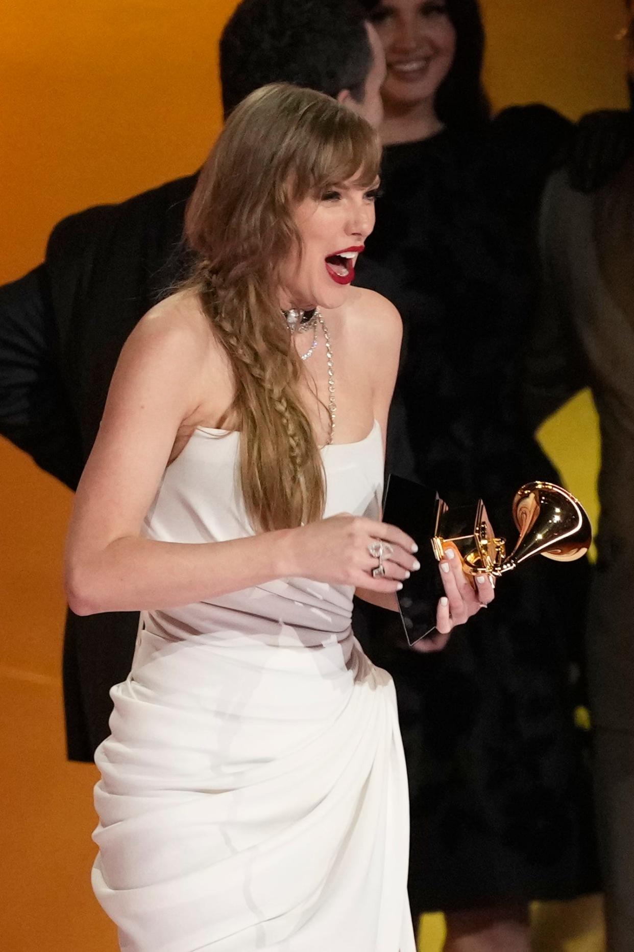 Taylor Swift accepts the award for album of the year.