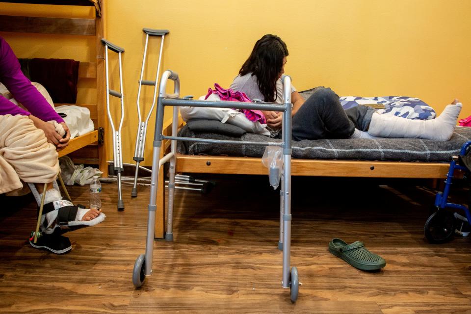 At left, Alma Zavala and another migrant woman who asked not to be identified recover from their limb injuries at a migrant shelter in El Paso, Texas, after falling from the border wall after attempting to cross illegally into the U.S. in October.