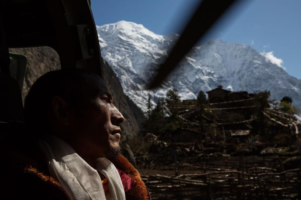 Nepal earthquake. Young Buddhist monks from Hinang Gompa (monastery) in the village of Lhi in Gorkha district in the Annapurna Range of the Himalayas were transported by Indian Army helicopter to Pokhara because the monastery was damaged in the earthquake. A boy was injured in the mountain village of Dhunchet and with his father was evacuated  by Indian Army helicopter. Mountain villages outside Pokhara that were destroyed. Food drops by Indian Army helicopters.  by James Nachtwey